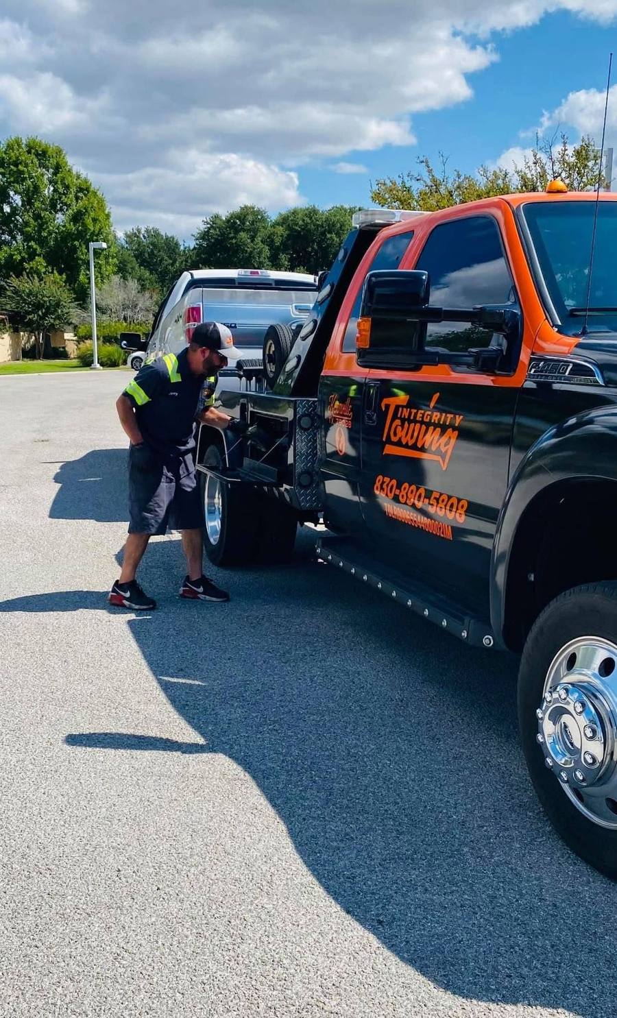 Jerry checking the hookup on a flatbed before a tow